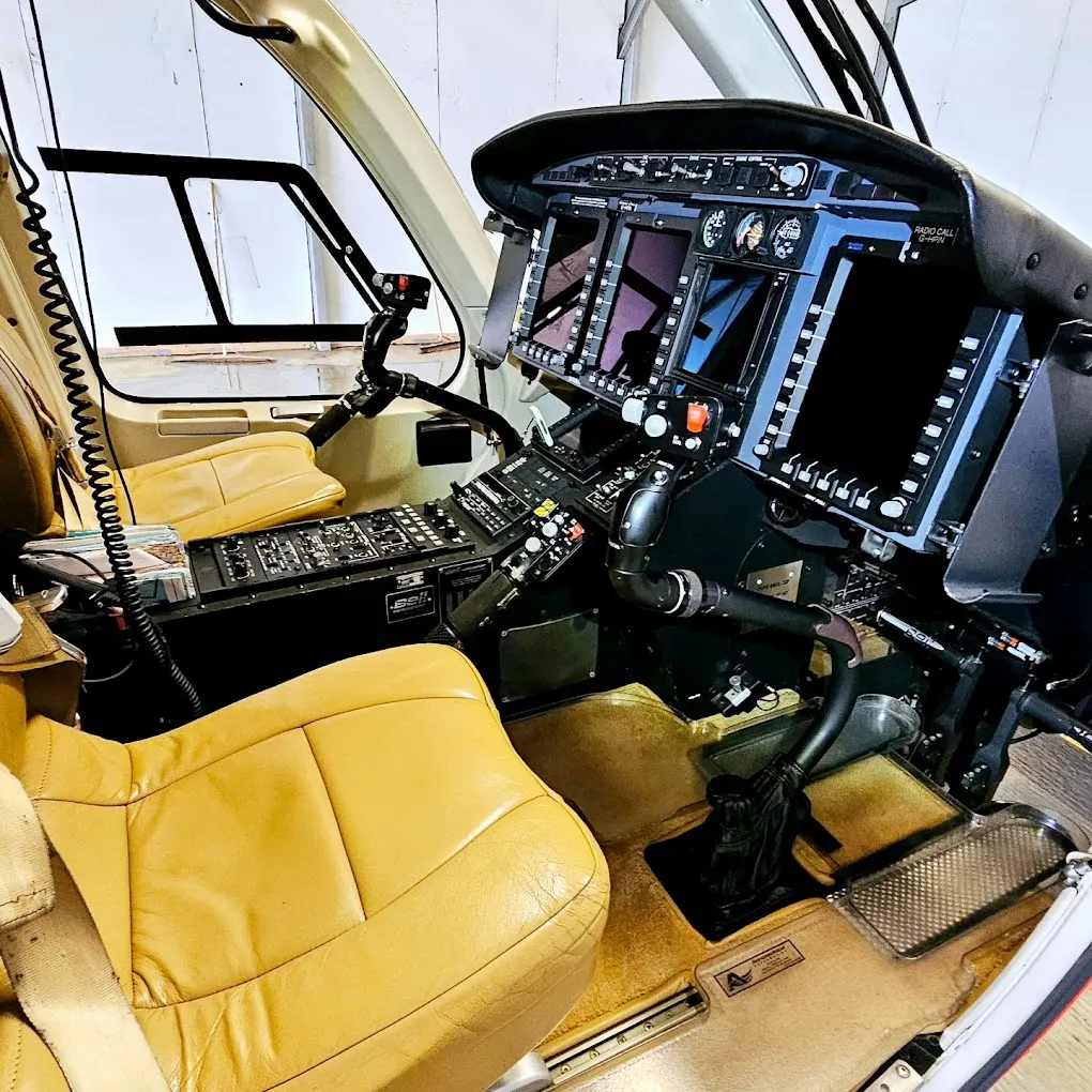 Helicopter cockpit with glass avionics and conditioned leather seating