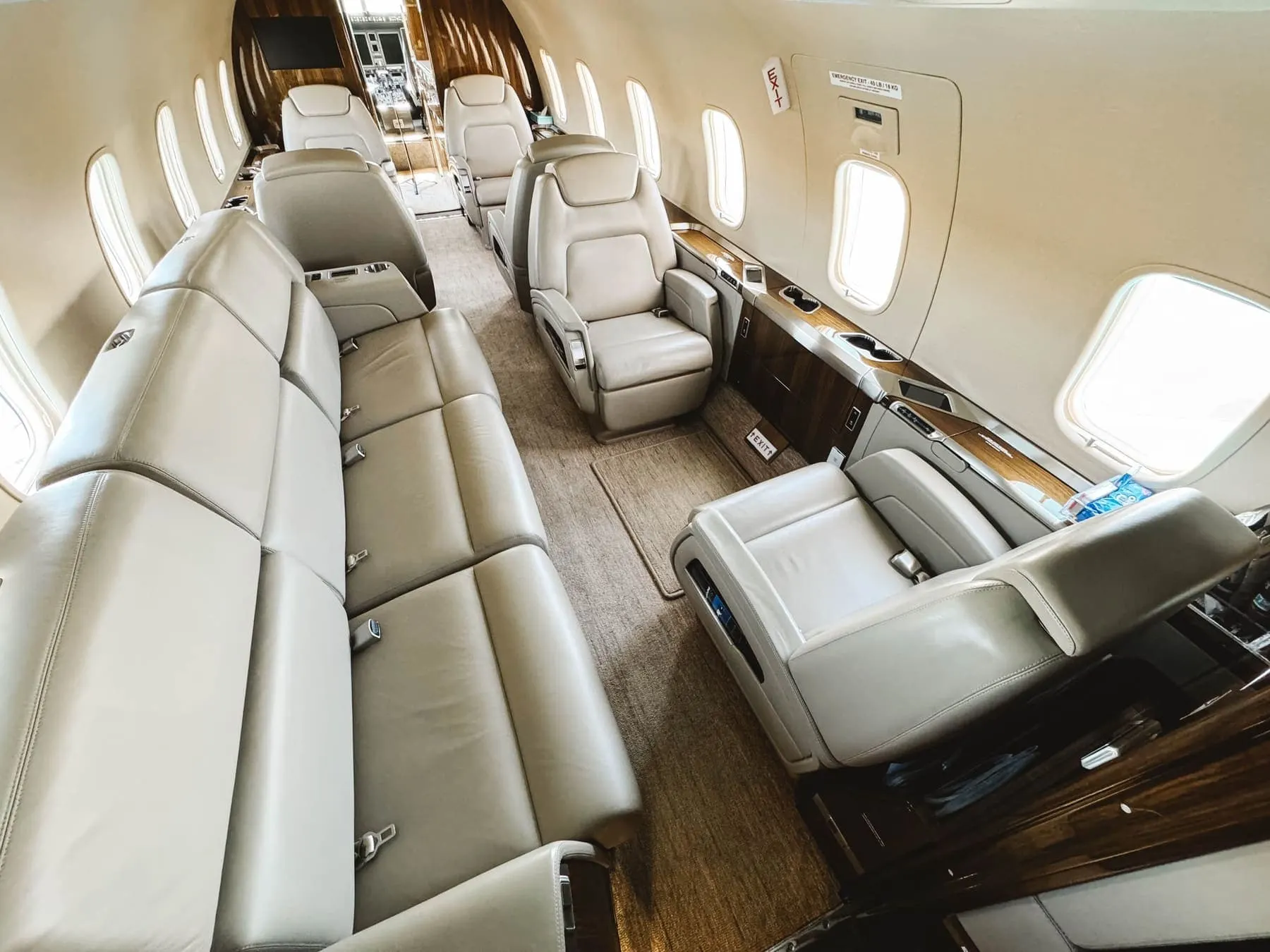 Large-cabin jet interior with full-length leather divan and executive seating